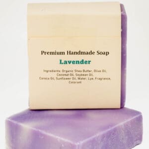 A lavender soap sitting on top of another bar.