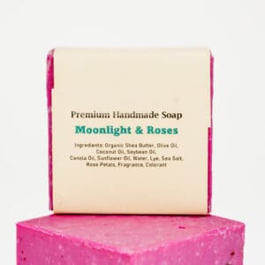 A pink box with a soap on top of it.
