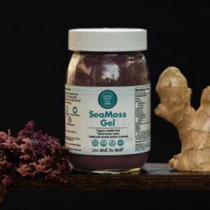 A jar of sea moss gel next to some ginger.